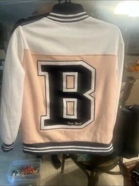Jacket pink and white varsity jacket featuring a "Brooklyn" design. Size s